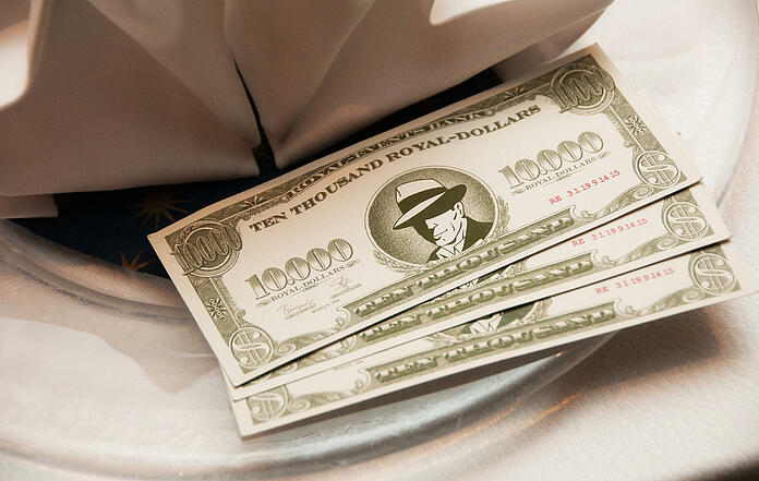 Royal dollars on a plate as a dessert for the launch of the mobile casino