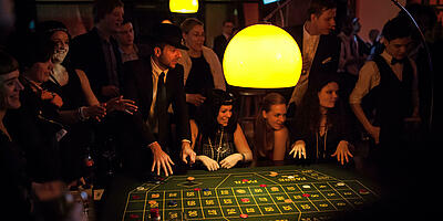 The guests wait eagerly for the picked number in roulette.