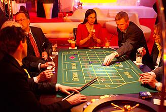 Roulette game table at an annual kick-off event Guest makes his bet at roulette at an annual kick-off event.