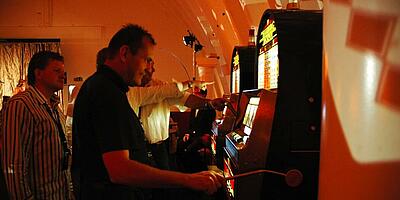 two one-armed bandits / slot machines are played.