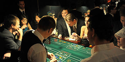 Guests play craps at a mafia event