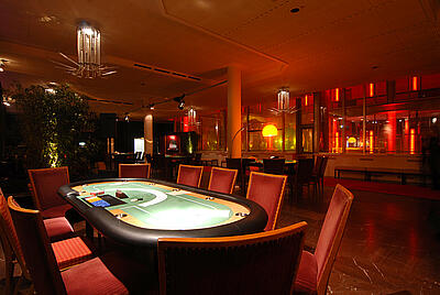 Poker table in the dim light Seated poker table in the dim light