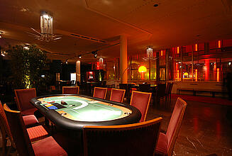 Poker table in the dim light Seated poker table in the dim light