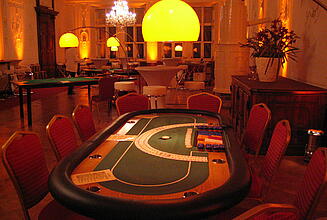 ready-to-use small poker table at an event Ready-to-use small poker table with seating at an event