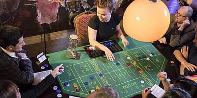 Bird's eye view of Chuck a Luck game table with guests