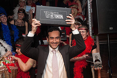 Winner lifts branded poker suitcase of the 1. FC Union in the height Winner of the casino raises black branded poker case of the 1. FC Union in the air.