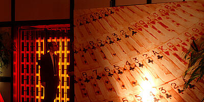 Handmade decoration display wall with laid out playing cards.