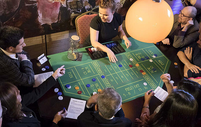 Bird's eye view of Chuck a Luck game table with guests