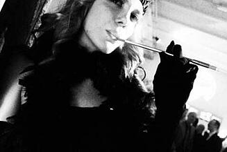 Woman with cigarette holder at Casino Royal 2010 dressed up woman with cigarette holder at Casino Royal 2010 (black and white picture)