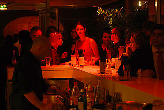 Bar at the Casino Moscow Several guests at Casino Moscow get drinks at the bar.