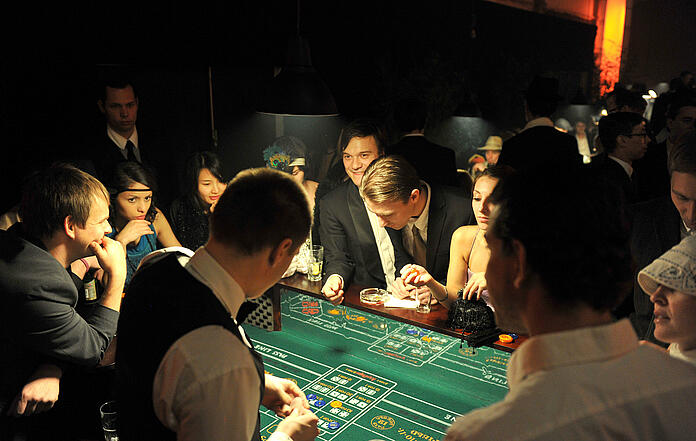 Guests play craps at a mafia event