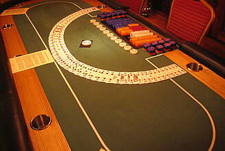 fanned playing cards on poker table fanned playing cards on a poker table ready for play