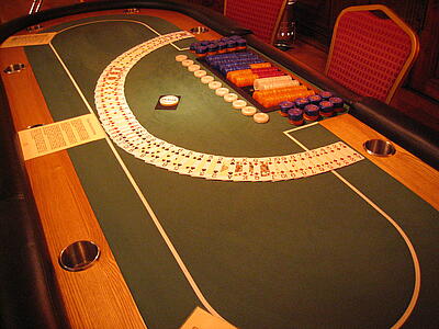 fanned playing cards on poker table fanned playing cards on a poker table ready for play