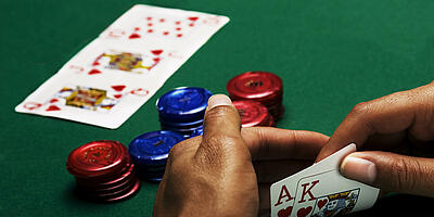 Player's hand shows a royal flush of hearts